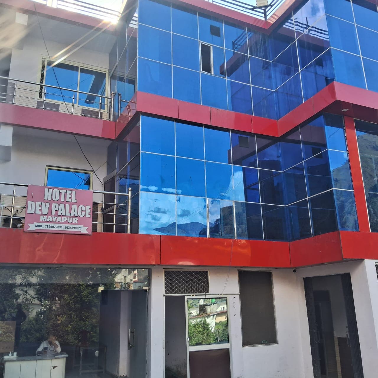 Happy traveler with backpack and suitcase